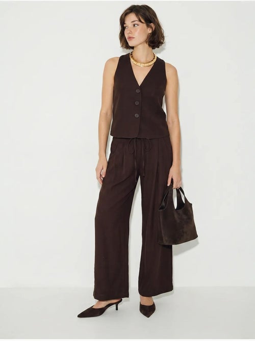 Conjunto de chaleco de algodón y pantalón de pernera ancha lucci - Kiabi Conjunto de chaleco de algodón y pantalón de pernera ancha lucci - Kiabi