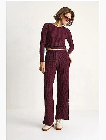Conjunto de dos piezas ajustado con pantalones acampanados lucci