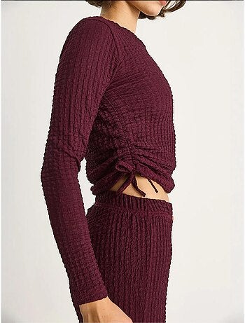 Conjunto de dos piezas ajustado con pantalones acampanados lucci