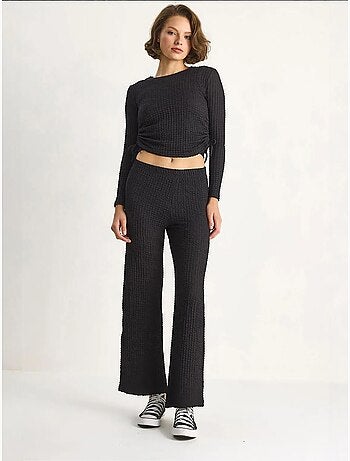 Conjunto de dos piezas ajustado con pantalones acampanados lucci