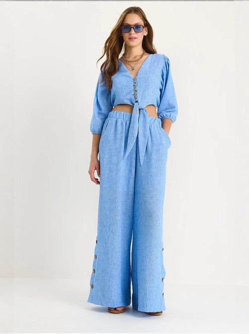 Conjunto de dos piezas con blusa y pantalón abotonado con detalle de lazo lucci - Kiabi Conjunto de dos piezas con blusa y pantalón abotonado con detalle de lazo lucci - Kiabi