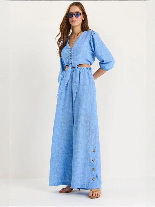 Conjunto de dos piezas con blusa y pantalón abotonado con detalle de lazo lucci - Kiabi Conjunto de dos piezas con blusa y pantalón abotonado con detalle de lazo lucci - Kiabi