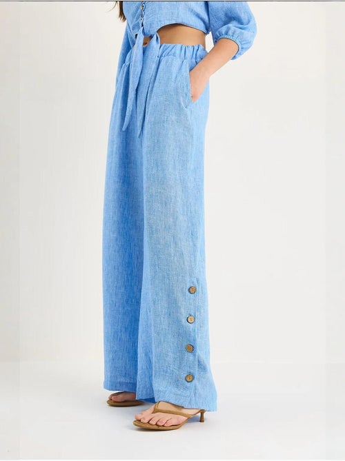 Conjunto de dos piezas con blusa y pantalón abotonado con detalle de lazo lucci - Kiabi Conjunto de dos piezas con blusa y pantalón abotonado con detalle de lazo lucci - Kiabi