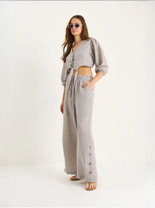 Conjunto de dos piezas con blusa y pantalón abotonado con detalle de lazo lucci - Kiabi