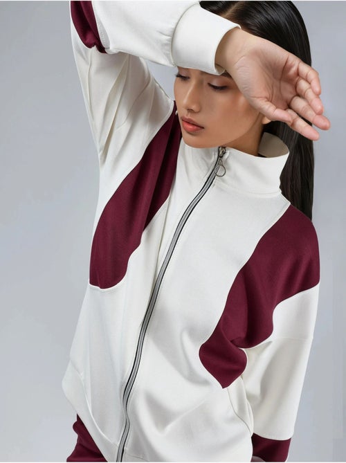 Conjunto de dos piezas con cuello con cremallera y pernera ancha y larga con bloques de color hiccup - Kiabi Conjunto de dos piezas con cuello con cremallera y pernera ancha y larga con bloques de color hiccup - Kiabi