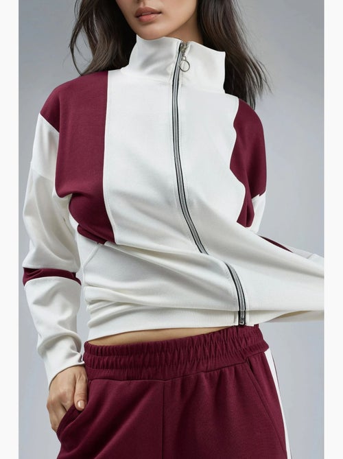 Conjunto de dos piezas con cuello con cremallera y pernera ancha y larga con bloques de color hiccup - Kiabi Conjunto de dos piezas con cuello con cremallera y pernera ancha y larga con bloques de color hiccup - Kiabi