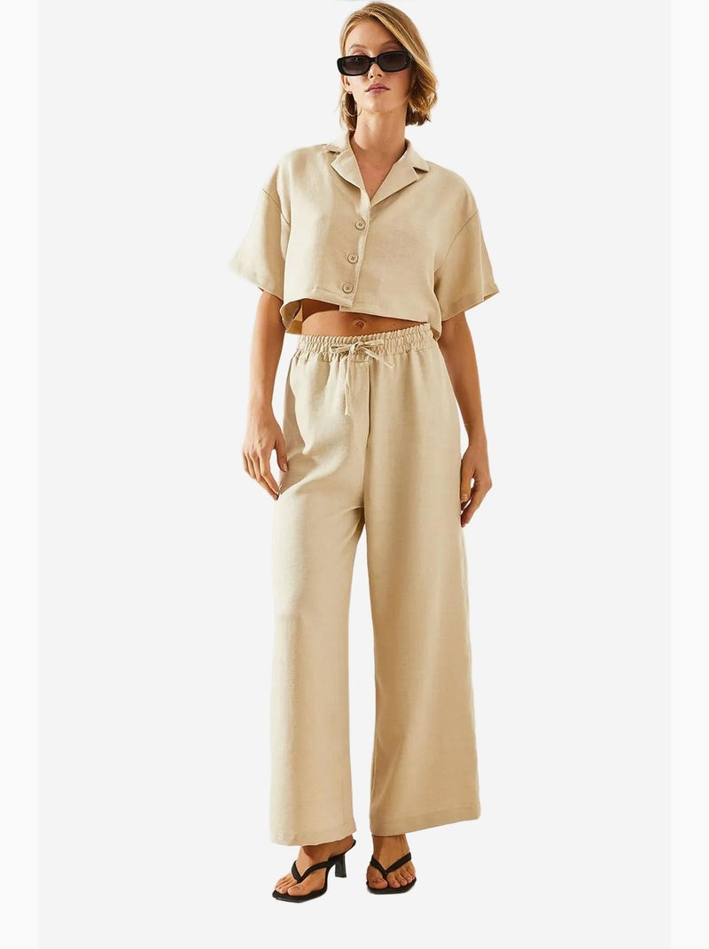 Conjunto de dos piezas con top corto, pantalón abotonado y bolsillos lucci Beige arcilla - Kiabi