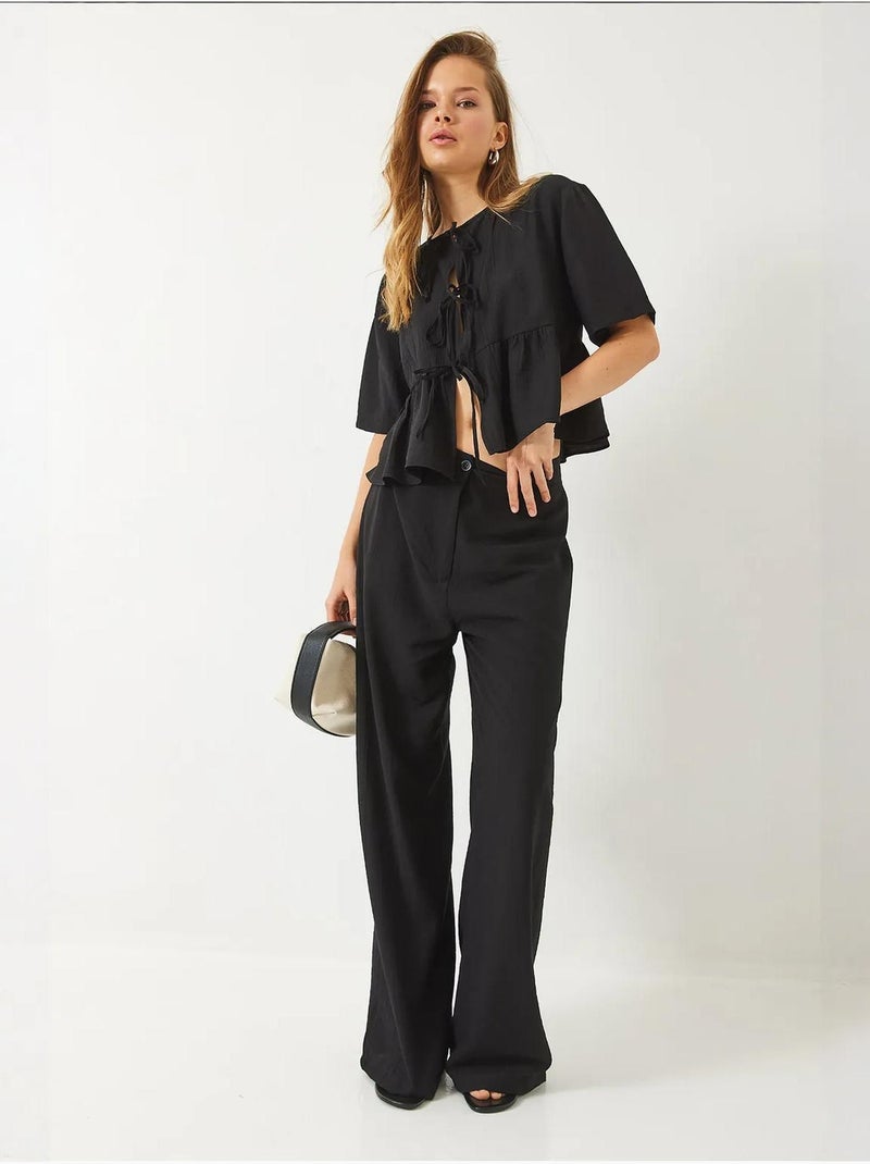 Conjunto de dos piezas de blusa y pantalón de manga corta con detalle de lazo lucci Negro - Kiabi