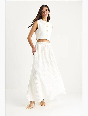Conjunto de falda larga y chaleco corto con cintura elástica y detalles de bolsillos lucci