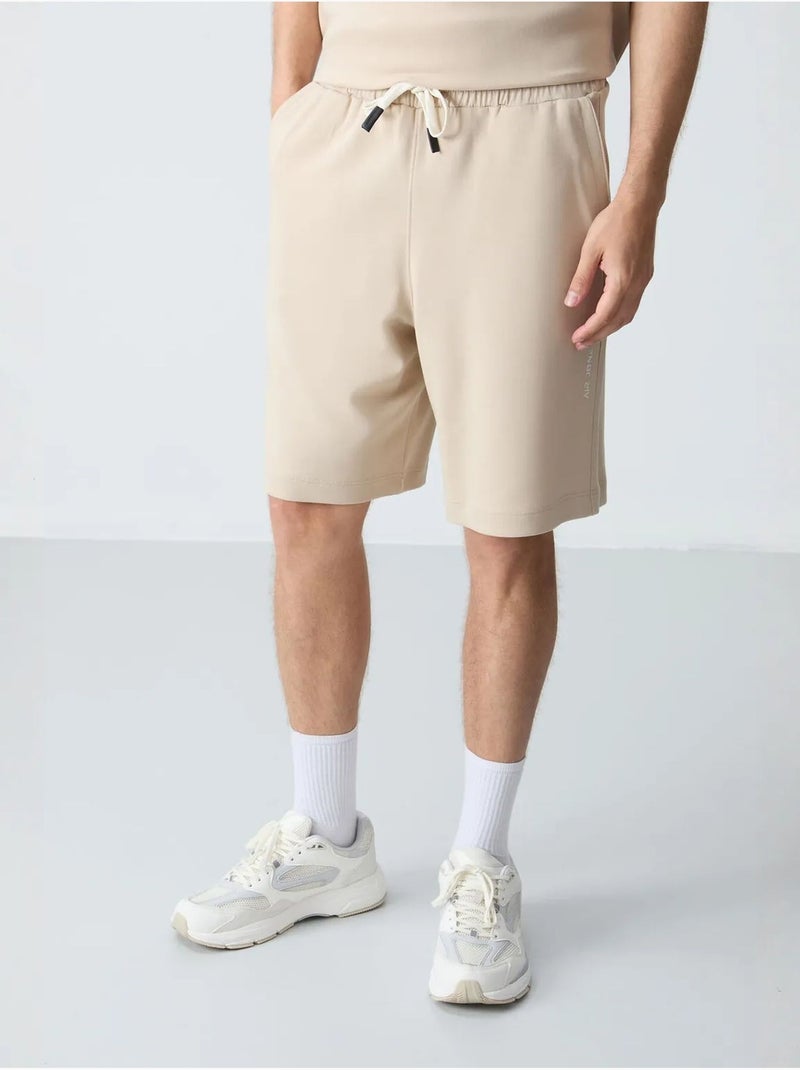 Conjunto de hombre de camiseta oversize y shorts de mezcla de algodón tommy Beige arcilla - Kiabi