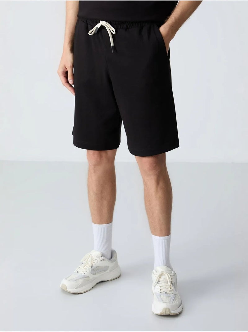 Conjunto de hombre de camiseta oversize y shorts de mezcla de algodón tommy Negro - Kiabi