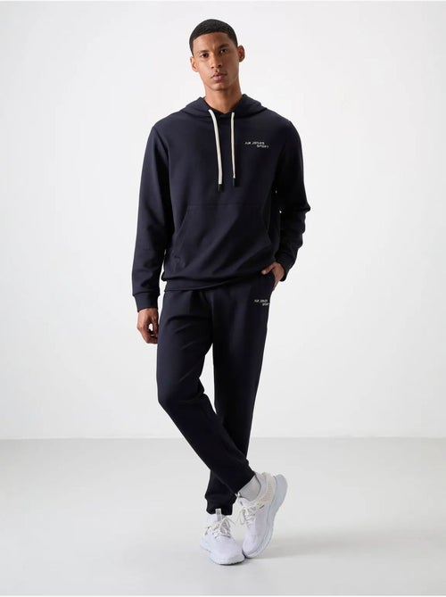 Conjunto de hombre de sudadera con capucha y pantalón tommy - Kiabi Conjunto de hombre de sudadera con capucha y pantalón tommy - Kiabi