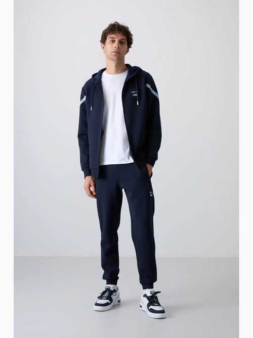 Conjunto de hombre de sudadera con capucha y pantalón tommy - Kiabi Conjunto de hombre de sudadera con capucha y pantalón tommy - Kiabi