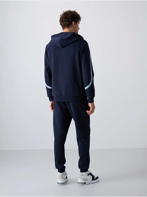 Conjunto de hombre de sudadera con capucha y pantalón tommy - Kiabi Conjunto de hombre de sudadera con capucha y pantalón tommy - Kiabi