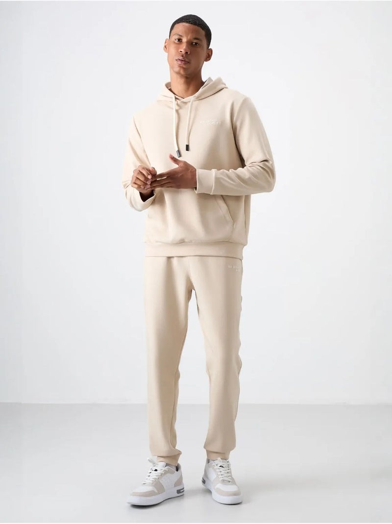 Conjunto de hombre de sudadera con capucha y pantalón tommy Beige arcilla - Kiabi