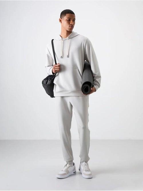 Conjunto de hombre de sudadera con capucha y pantalón tommy - Kiabi Conjunto de hombre de sudadera con capucha y pantalón tommy - Kiabi