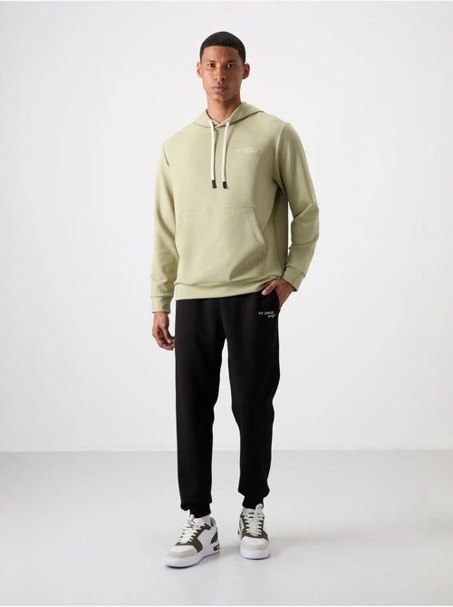 Conjunto de hombre de sudadera con capucha y pantalón tommy - Kiabi Conjunto de hombre de sudadera con capucha y pantalón tommy - Kiabi