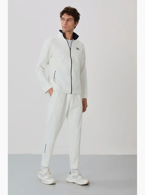 Conjunto de hombre de sudadera con cuello con cremallera y pantalón tommy - Kiabi Conjunto de hombre de sudadera con cuello con cremallera y pantalón tommy - Kiabi