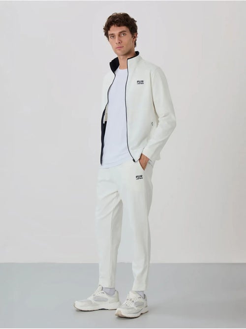 Conjunto de hombre de sudadera con cuello con cremallera y pantalón tommy - Kiabi Conjunto de hombre de sudadera con cuello con cremallera y pantalón tommy - Kiabi