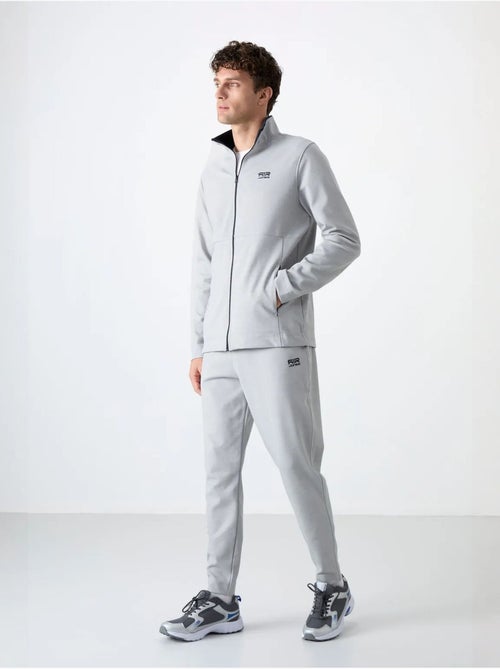 Conjunto de hombre de sudadera con cuello con cremallera y pantalón tommy - Kiabi Conjunto de hombre de sudadera con cuello con cremallera y pantalón tommy - Kiabi