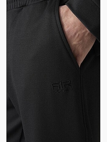 Conjunto de hombre de sudadera con cuello con cremallera y pantalón tommy