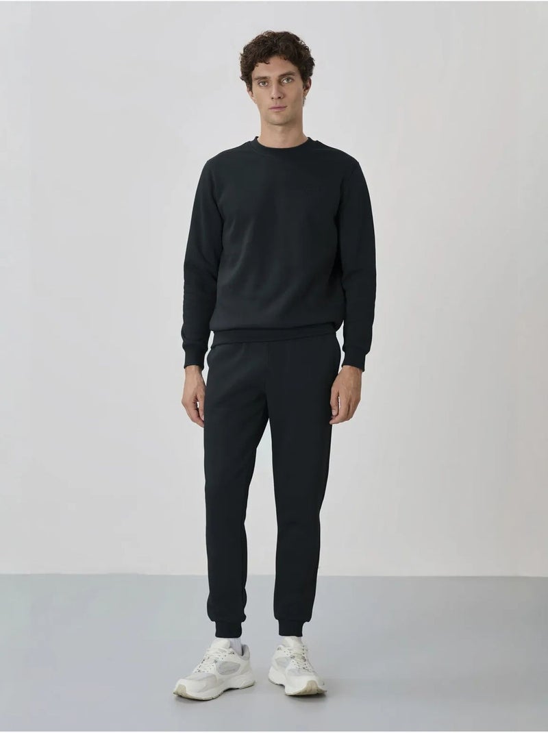 Conjunto de hombre de sudadera y pantalón de felpa de algodón y poliéster tommy Azul petróleo - Kiabi