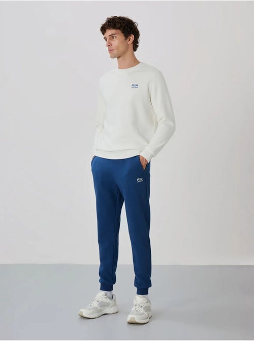 Conjunto de hombre de sudadera y pantalón de felpa de algodón y poliéster tommy - Kiabi Conjunto de hombre de sudadera y pantalón de felpa de algodón y poliéster tommy - Kiabi