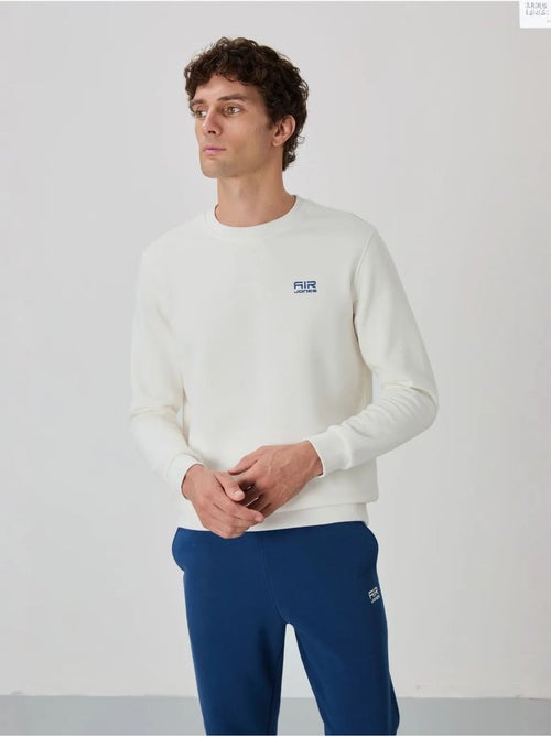 Conjunto de hombre de sudadera y pantalón de felpa de algodón y poliéster tommy - Kiabi Conjunto de hombre de sudadera y pantalón de felpa de algodón y poliéster tommy - Kiabi