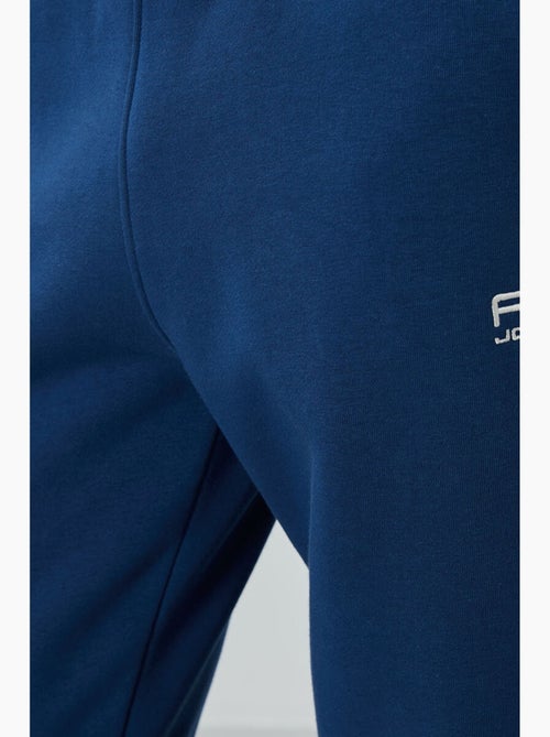 Conjunto de hombre de sudadera y pantalón de felpa de algodón y poliéster tommy - Kiabi Conjunto de hombre de sudadera y pantalón de felpa de algodón y poliéster tommy - Kiabi