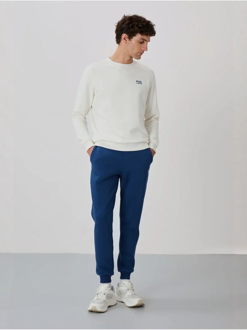 Conjunto de hombre de sudadera y pantalón de felpa de algodón y poliéster tommy Blanco - Kiabi