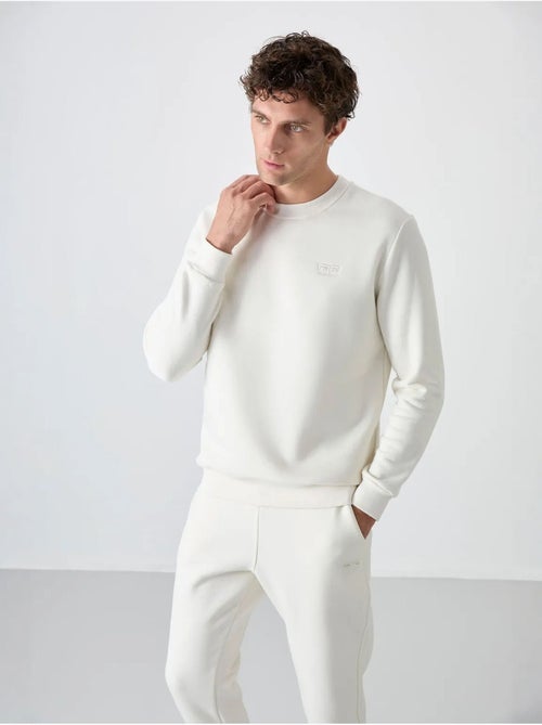 Conjunto de hombre de sudadera y pantalón de felpa de algodón y poliéster tommy - Kiabi Conjunto de hombre de sudadera y pantalón de felpa de algodón y poliéster tommy - Kiabi