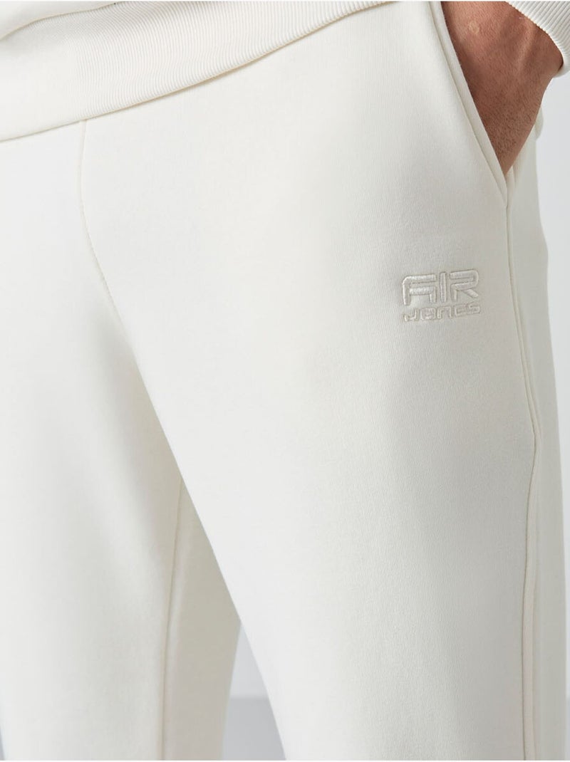 Conjunto de hombre de sudadera y pantalón de felpa de algodón y poliéster tommy Blanco roto - Kiabi