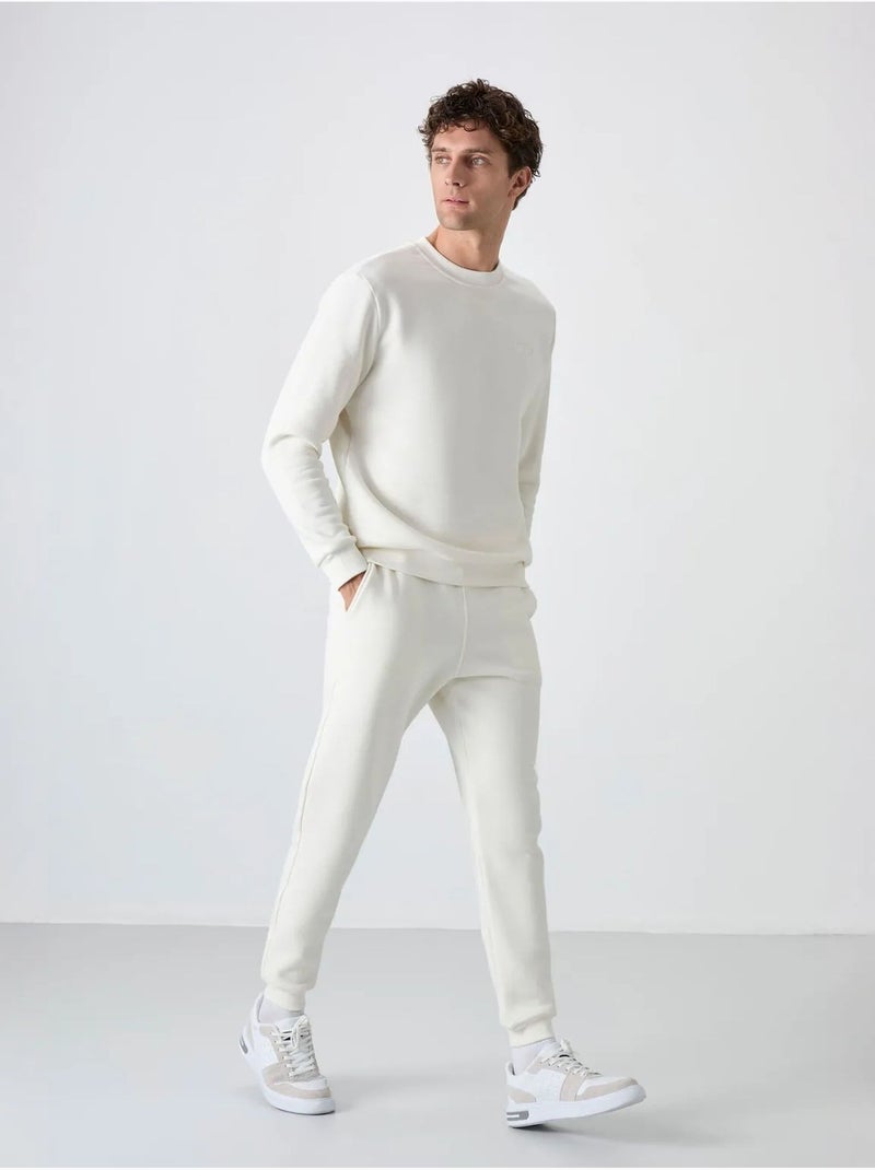 Conjunto de hombre de sudadera y pantalón de felpa de algodón y poliéster tommy Blanco roto - Kiabi