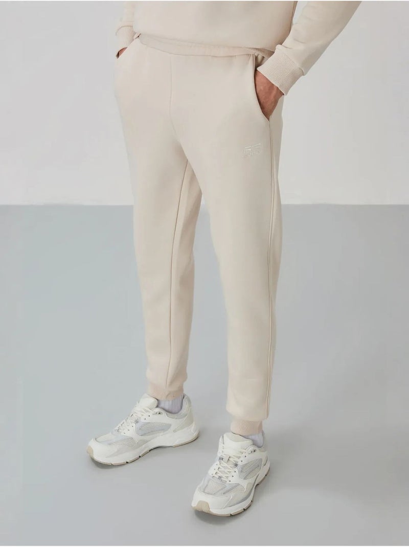 Conjunto de hombre de sudadera y pantalón de felpa de algodón y poliéster tommy Crudo - Kiabi