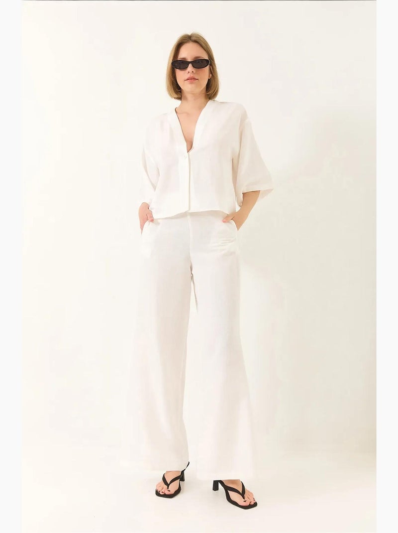 Conjunto de pantalón kimono palazzo de lino con mangas murciélago y cuello en v lucci Blanco - Kiabi