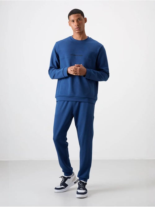 Conjunto de sudadera y pantalón de forro polar estampado tommy - Kiabi Conjunto de sudadera y pantalón de forro polar estampado tommy - Kiabi
