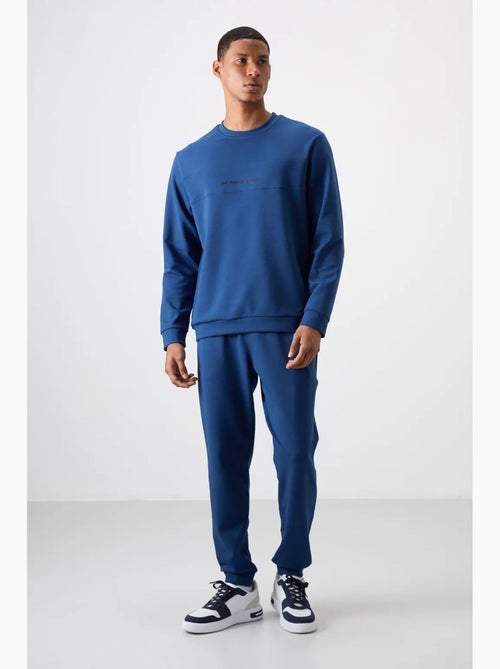Conjunto de sudadera y pantalón de forro polar estampado tommy - Kiabi Conjunto de sudadera y pantalón de forro polar estampado tommy - Kiabi