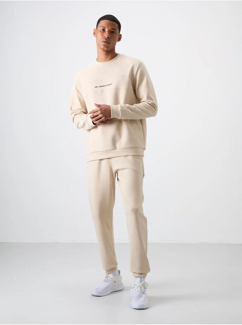 Conjunto de sudadera y pantalón de forro polar estampado tommy Beige arcilla - Kiabi