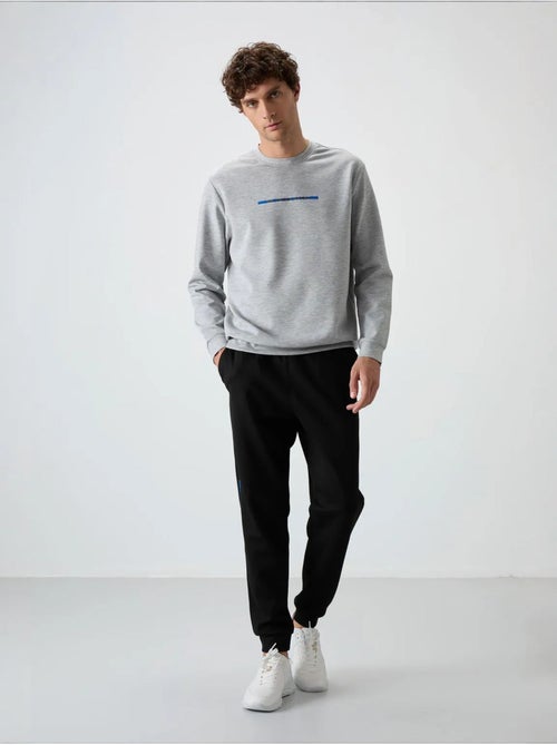 Conjunto de sudadera y pantalón de punto acanalado para hombre tommy - Kiabi Conjunto de sudadera y pantalón de punto acanalado para hombre tommy - Kiabi