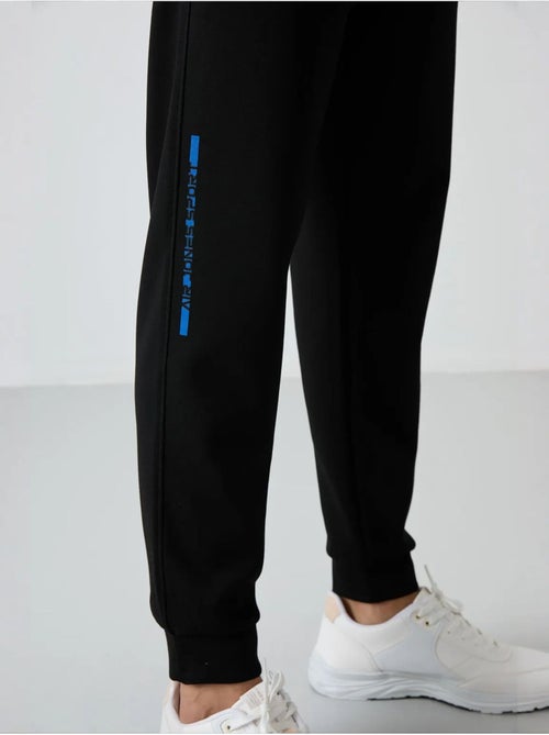 Conjunto de sudadera y pantalón de punto acanalado para hombre tommy - Kiabi Conjunto de sudadera y pantalón de punto acanalado para hombre tommy - Kiabi