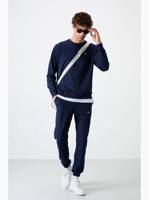 Conjunto de sudadera y pantalón oversize cuello redondo tommy - Kiabi Conjunto de sudadera y pantalón oversize cuello redondo tommy - Kiabi