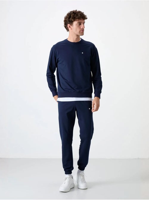 Conjunto de sudadera y pantalón oversize cuello redondo tommy - Kiabi Conjunto de sudadera y pantalón oversize cuello redondo tommy - Kiabi