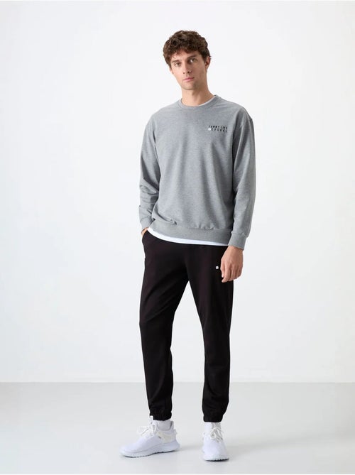 Conjunto de sudadera y pantalón oversize cuello redondo tommy - Kiabi Conjunto de sudadera y pantalón oversize cuello redondo tommy - Kiabi
