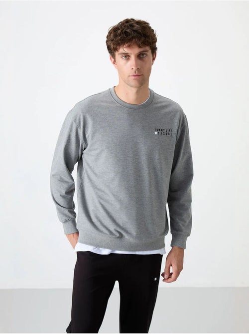 Conjunto de sudadera y pantalón oversize cuello redondo tommy - Kiabi Conjunto de sudadera y pantalón oversize cuello redondo tommy - Kiabi