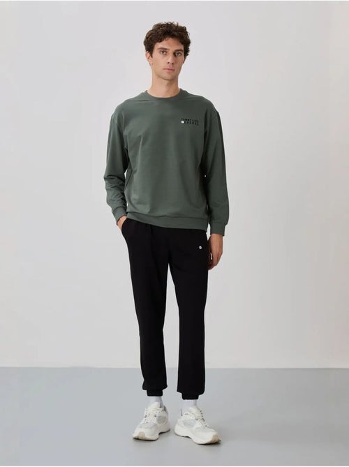 Conjunto de sudadera y pantalón oversize cuello redondo tommy - Kiabi Conjunto de sudadera y pantalón oversize cuello redondo tommy - Kiabi
