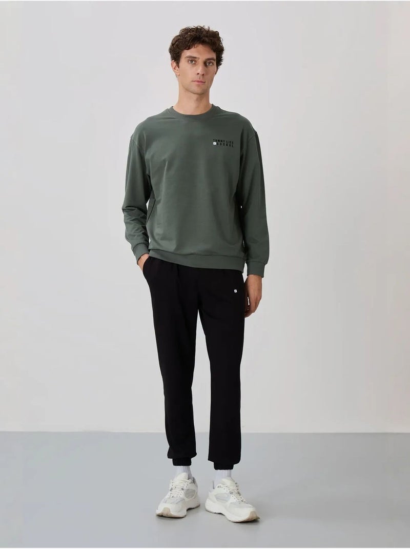 Conjunto de sudadera y pantalón oversize cuello redondo tommy Verde oscuro - Kiabi