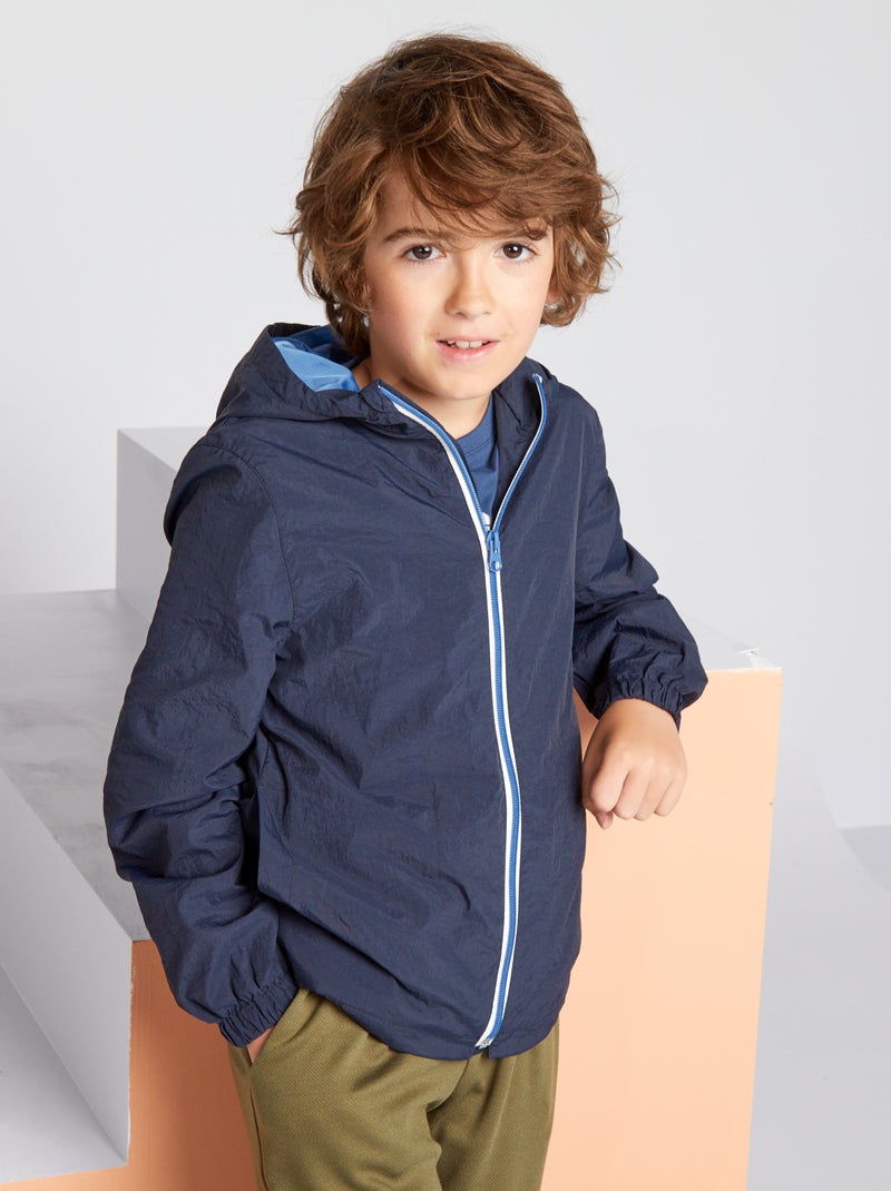 Cortavientos impermeable con capucha azul - Kiabi