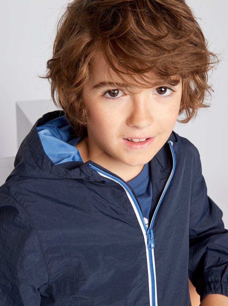 Cortavientos impermeable con capucha azul - Kiabi