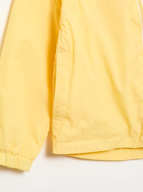 Cortavientos liso que se guarda en su capucha - Kiabi