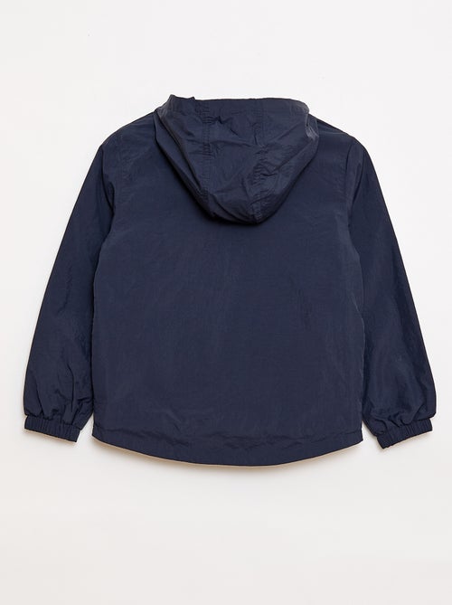 Cortavientos liso que se guarda en su capucha - Kiabi